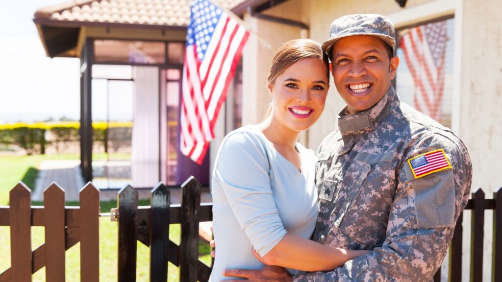 Veteran homeowner couple reviewing VA refinance loan options with Andes Mortgage